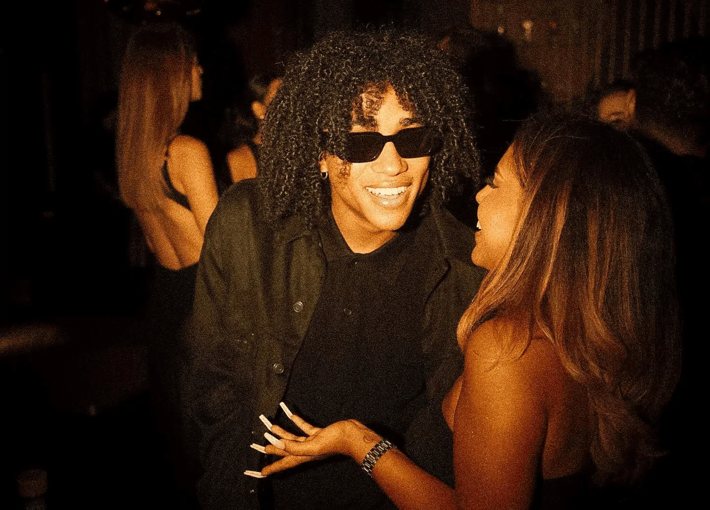 Kash Corleone Rogers, smiling at an event
