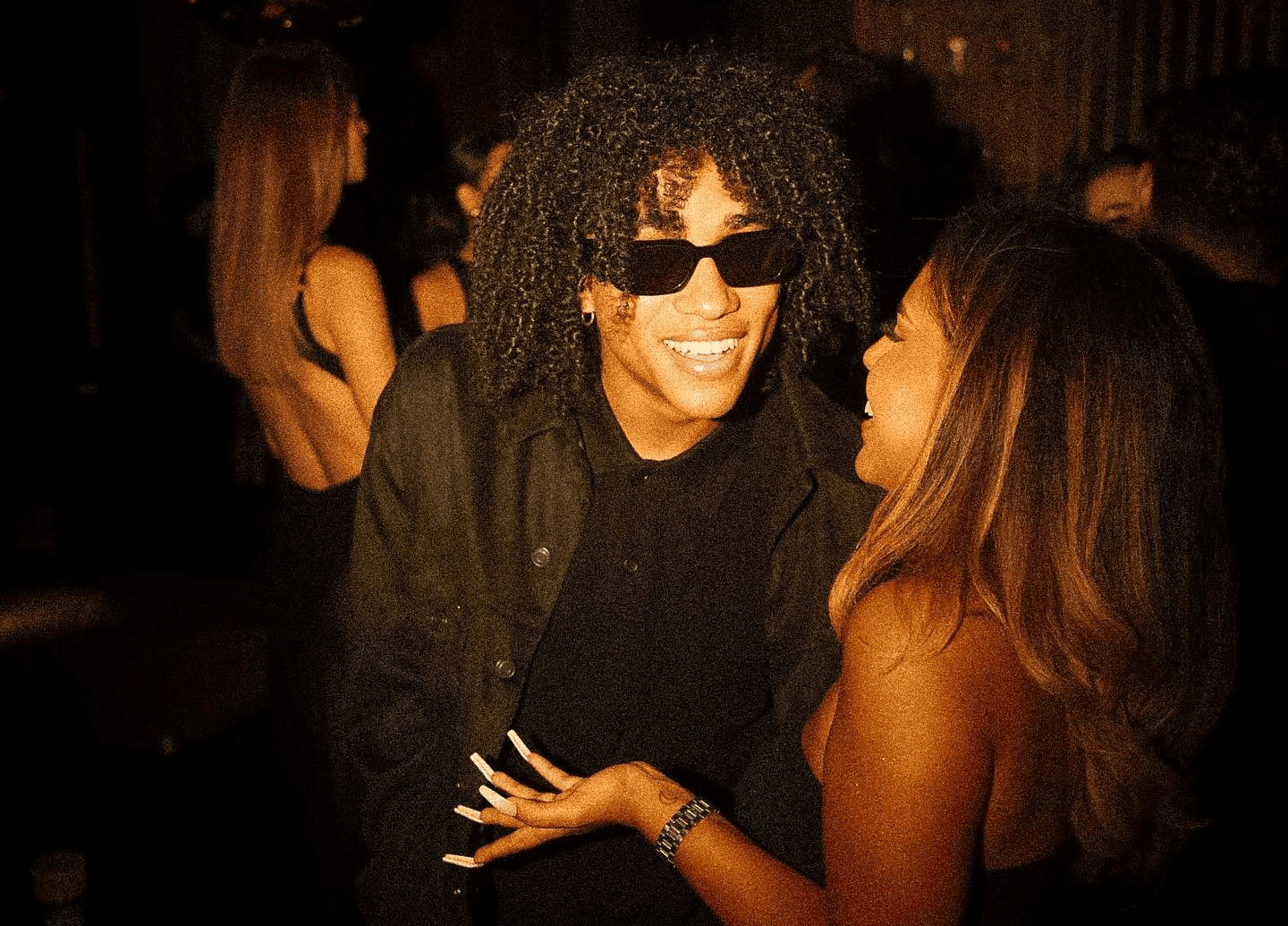 Kash Corleone Rogers, smiling at an event